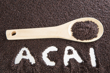 acai powder in wooden spoon