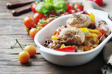 Cooked chicken with tomato, oilve and paprika