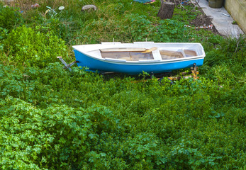 old boat, old boat in a grass, old boat abandoned on the field, Old destroyed wooden boats on the ground