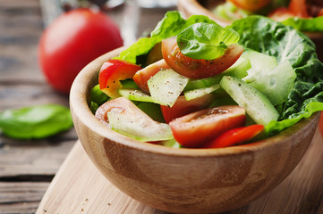 Concept of healthy food: salad with tomato and cucumber