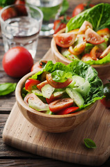 Concept of healthy food: salad with tomato and cucumber