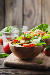 Concept of healthy food: salad with tomato and cucumber