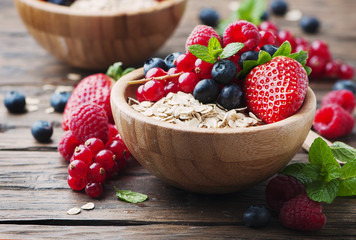 Oats withmix of berry on the wooden table