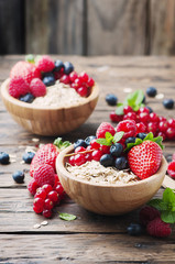 Oats withmix of berry on the wooden table