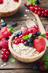 Oats withmix of berry on the wooden table