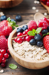 Oats withmix of berry on the wooden table