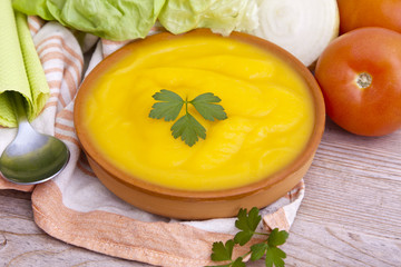 clay plate with soup and vegetable soup