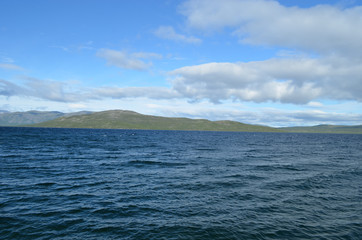 Fototapeta na wymiar Blue water of lake Torneträsk, subarctic Swedish Lapland