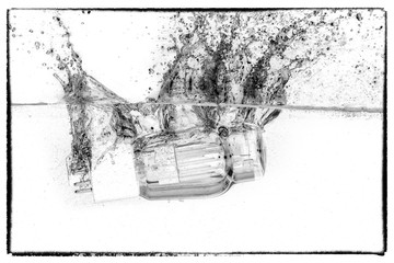 Vacuum tube valve drop in the water. Black and white picture. Thermionic valve is used in hi-fi...