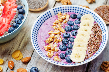 Blueberries healthy smoothies breakfast bowls with nuts, seeds a