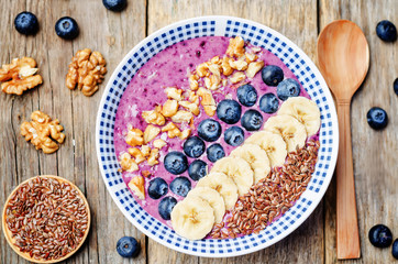 Blueberries healthy smoothies breakfast bowls with nuts, seeds a