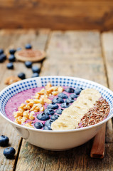 Blueberries healthy smoothies breakfast bowls with nuts, seeds a