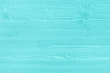 Natural wooden turquoise boards, wall or fence with knots. Abstract textured mint background, empty template