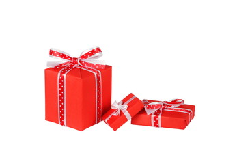 wrapped red gift boxes with ribbon bows isolated on white
