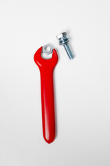 Red rubbered tools  on white surface. Isolated