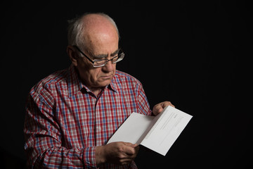 old man with bank document
