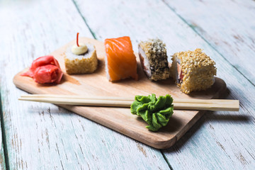 Sushi rolls with soy sauce, wasabi and pickled ginger