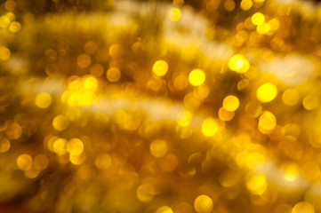 Obraz premium Gold shiny tinsel. Blurred, bokeh