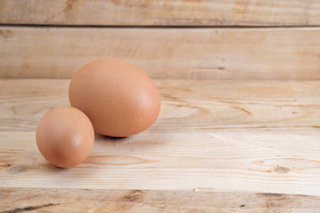 Eggs / Brown eggs placed on wooden floor.