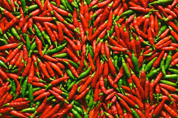 Background image of red and green peppers.