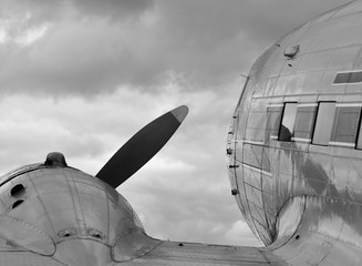 view over the wing of a historic airplane, black and white