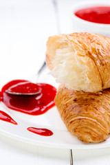 Close up strawberry jam croissant