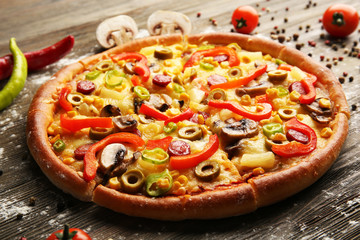 Delicious sliced pizza with vegetables, close-up