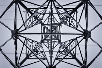 Fototapeta premium Inner view of a frozen power transmission tower