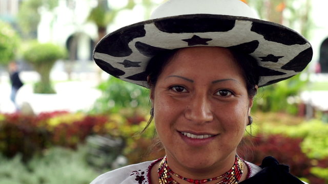 Close up portrait shot of an indigenous Saraguro woman wearing traditional dress in the province of Loja and the country of Ecuador.