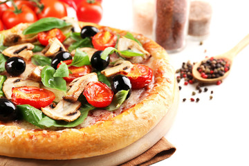 Delicious tasty pizza with vegetables on cutting board