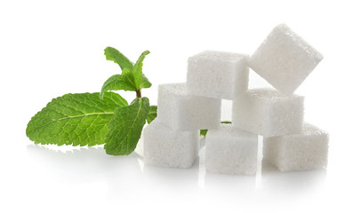 Pile of sugar cubes and stevia isolated on white background