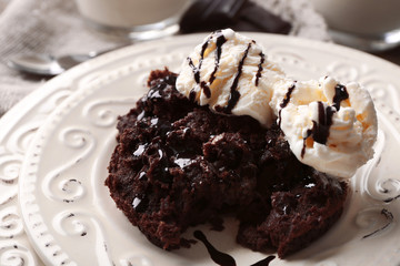 Chocolate lava cake with ice-cream on the plate, close-up