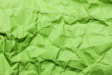Crumpled green paper background.