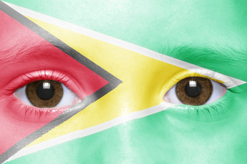 human's face with guyanese flag