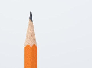 close up of orange pencil isolated on white background
