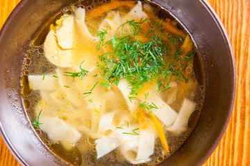 Soup with chicken, noodles and egg