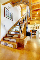 Interior of artsy home with brilliant staircase.