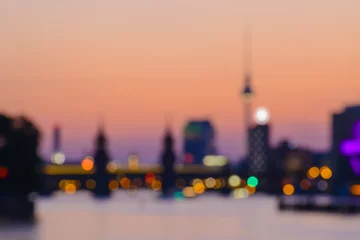 Fotobehang abstract blurred background of Berlin with TV Tower, Oberbaumbruecke and Spree River at evening, Germany, Europe © AR Pictures