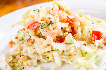 Salad with cabbage, shrimp and avocado