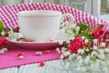 Cup of tea and roses