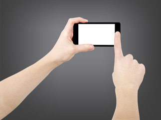 Hands taking photo on smartphone, empty screen, isolated on dark background, clipping path