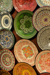 Ornate plates, Marrakech, Morocco, Africa.  Pottery glazed plates for the tourism market in the Kasbah.