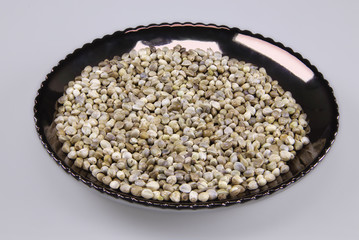 Hemp seeds on a dark plate