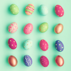 Vintage pastel easter eggs over mint background