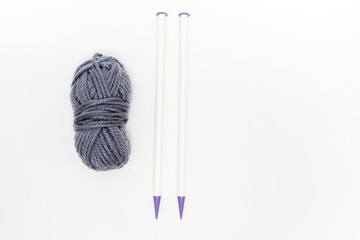 Ball of yarn with knitting needles