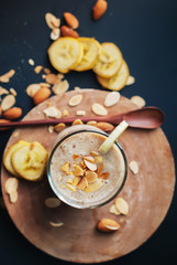 Fruit banana smoothies with milk, almond, flakes