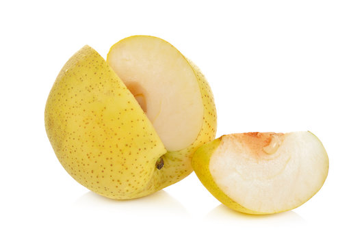 whole and cut pear on white background