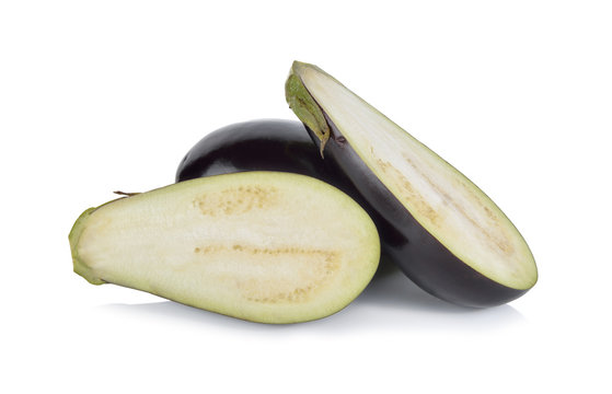 whole and half cut eggplant on white background