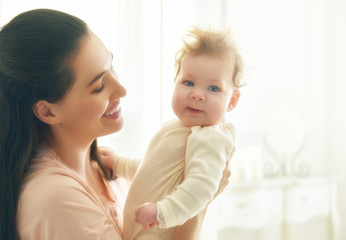 mother playing with her baby