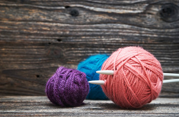 Balls of yarn with knitting needles